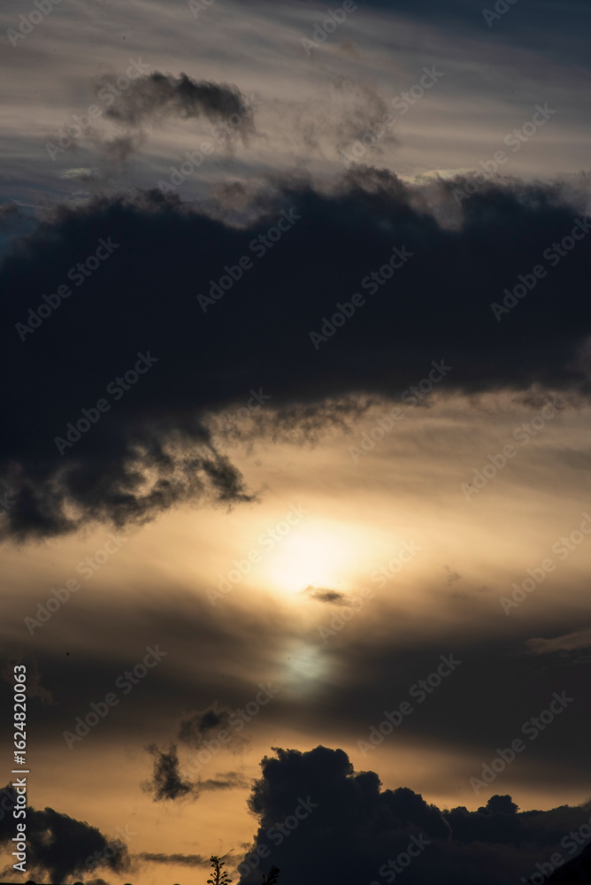 Obraz premium Vertical Dramatic dark storm rain clouds black sky background. Dark thunderstorm clouds rainny atmosphere. windstorm disasters climate. Dust ominous cloudscape storm disaster gloomy gray cloud sky