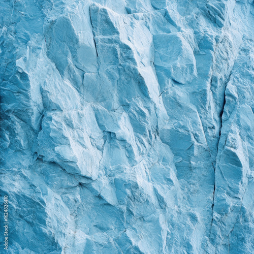 Wallpaper Mural Close up of textured blue rock surface, showcasing intricate patterns and natural formations. cool tones and rugged texture evoke sense of calm and strength Torontodigital.ca