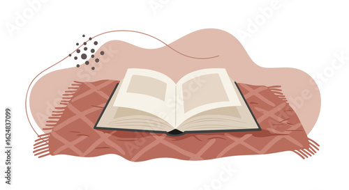 Open book laying on blanket indoors with abstract design for learning concepts