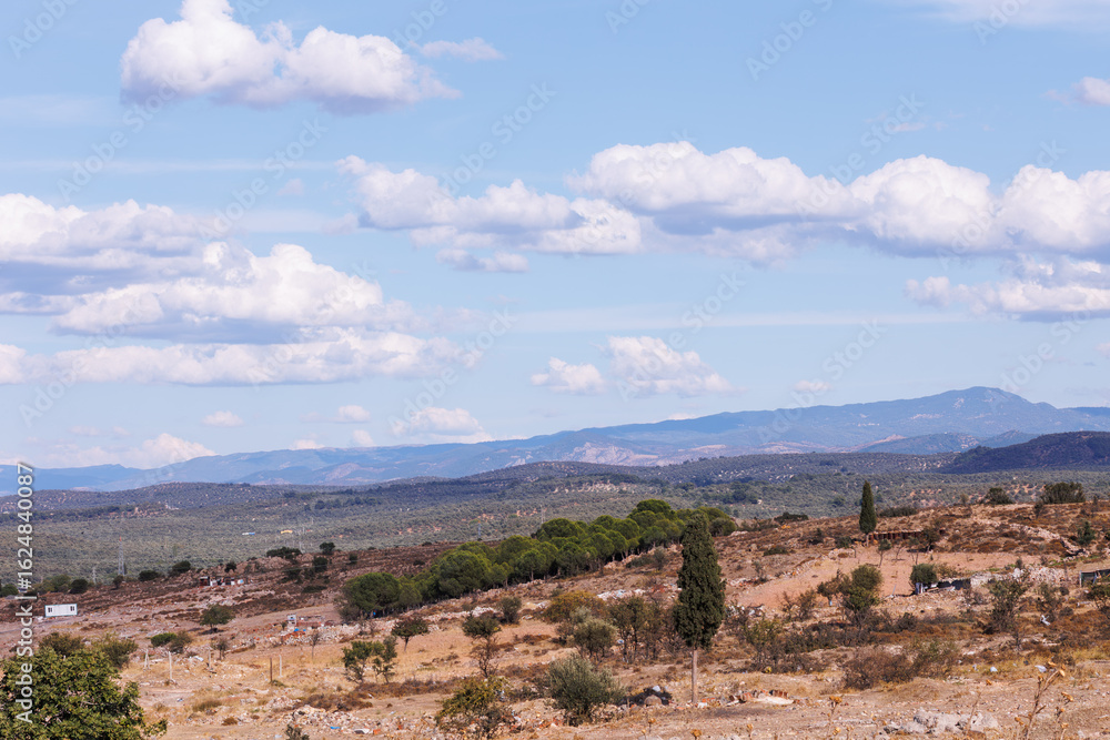 Naklejka premium a rubble-strewn field and mountains in the background, Ayvalk, Balikesir, on 23 September 2022