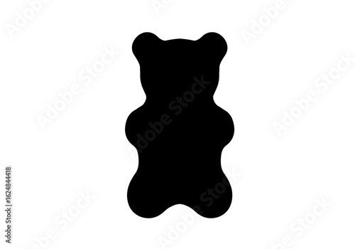 A stark black silhouette of a gummy bear isolated against a white background space