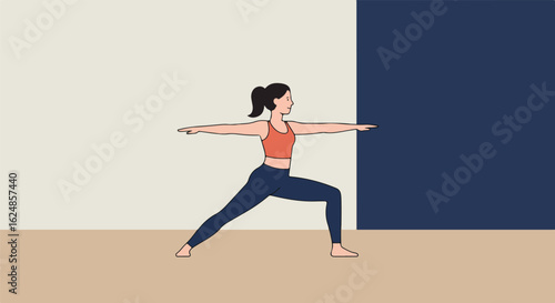 Woman performs warrior two pose at studio, with two-tone wall backdrop