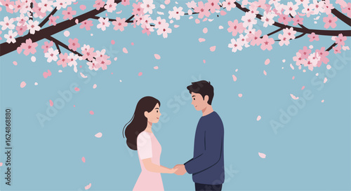 Couple holds hands under blooming cherry trees with petals falling in spring. Possible use ad