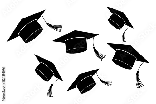 Black graduation caps with tassels scattered on white academic education