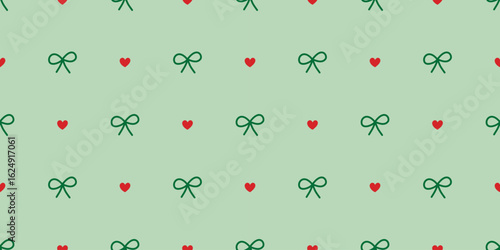 Seamless bow and heart pattern in pastel green