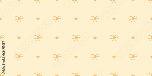 Seamless bow and heart pattern in warm yellow