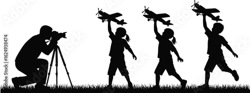 Silhouette, photographer with tripod, children playing, toy airplanes, outdoor creativity, joyful memories, imaginative scene, capturing childhood, fun, nature