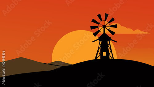 Stunning windmill silhouetted against a vibrant bright sunset sky