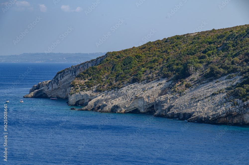 Fototapeta premium Caves of Zakynthos, Greece – Coastal Rock Formations and Crystal Waters