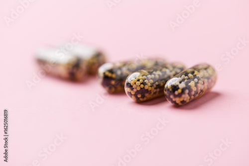 Wallpaper Mural Iron capsules on bright background. Soft focus. Close up. Copy space.	 Torontodigital.ca