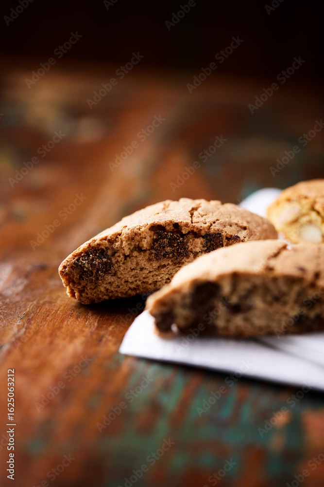 Fototapeta premium Cantuccini (Italian cookies) on dark wooden background. Close up 