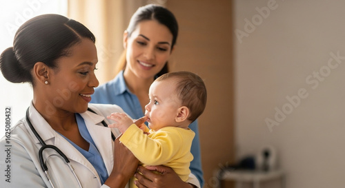 A caring Black female pediatrician holding a baby with its smiling mother nearby, perfect for illustrating diversity in medicine and trusted pediatric care