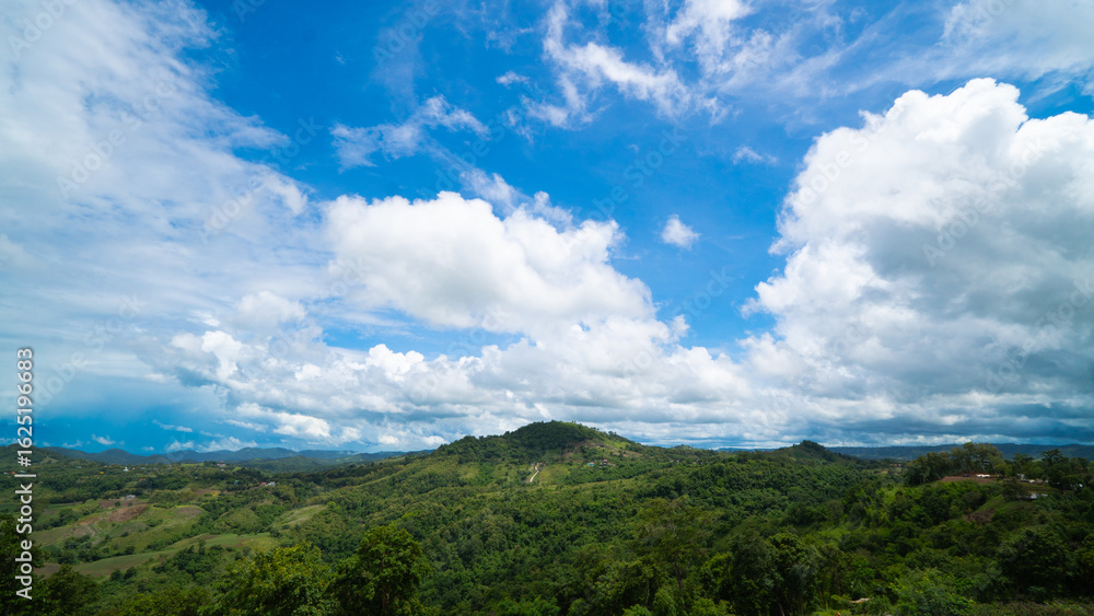Vast green hills and mountains stretch under a brilliant blue sky dotted with fluffy white clouds. Capturing the serenity of nature landscape. Ideal for travel environment and outdoor themes. Vast green hills and mountains stretch under a brilliant blue sky dotted with fluffy white clouds. Capturing the serenity of nature landscape. Ideal for travel environment and outdoor themes.