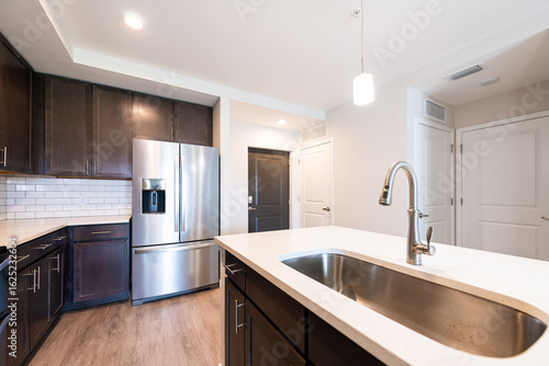 Wallpaper Mural Empty kitchen modern apartment house home with sink faucet quartz countertop island by new fridge refrigerator wood cabinets and recessed ceiling lamp light Torontodigital.ca