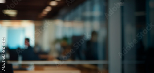 Blurred modern office interior with warm lighting