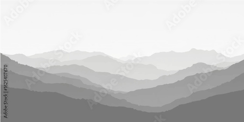 Foggy mountain landscape with clouds and layered peaks