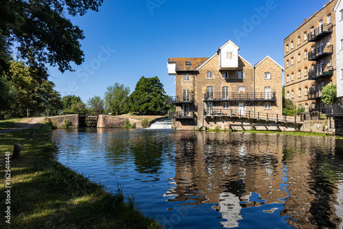 Historic coxes Lock and flour mill on the River Wey Navigations in Addlestone, Surrey