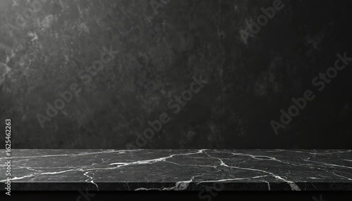 Fototapeta Naklejka Na Ścianę i Meble -  Elegant black marble countertop surface provides clean, empty display area against dark textured wall background. Luxurious stone texture with white veins offers sophisticated, minimalist aesthetic