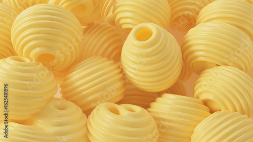 Close-up of many small, textured, yellow butter balls.
