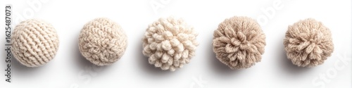 Five knitted, light beige, round balls on white background