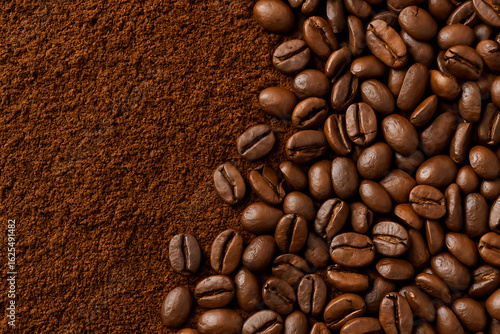 Coffee beans on ground coffee background, roasted coffee bean texture, fresh aromatic espresso ingredient, barista cafe drink preparation, gourmet coffee powder and beans, caffeine energy concept for 