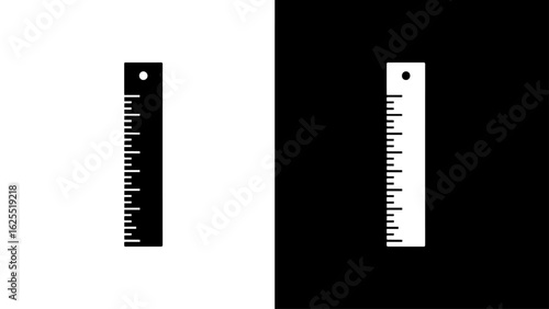 A simple black and white ruler stands vertically against a split background, representing measurement and duality.