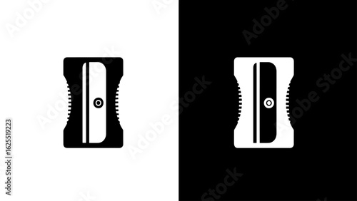 A black and white close-up shot of a simple hand crank pencil sharpener, isolated on a contrasting background, evokes a feeling of utilitarian simplicity.