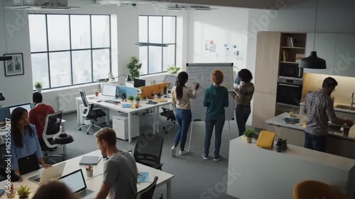 Diverse team collaborating in a modern open plan office with city views