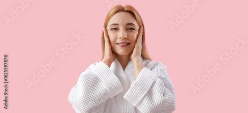Happy mature woman in bathr...