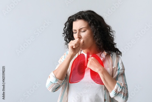 Coughing woman with pain in...
