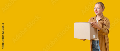 Young woman with parcel box...