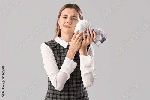 Young businesswoman with ic...