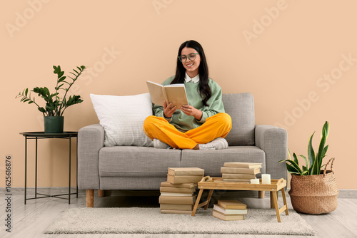 Beautiful woman reading boo...