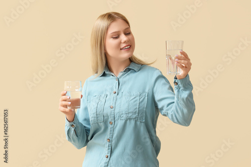 Young woman with glasses of...