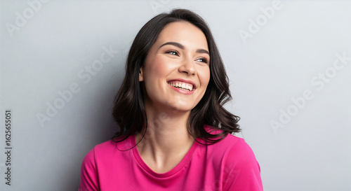 Happy Young Woman Smiling Looking Away Studio Portrait