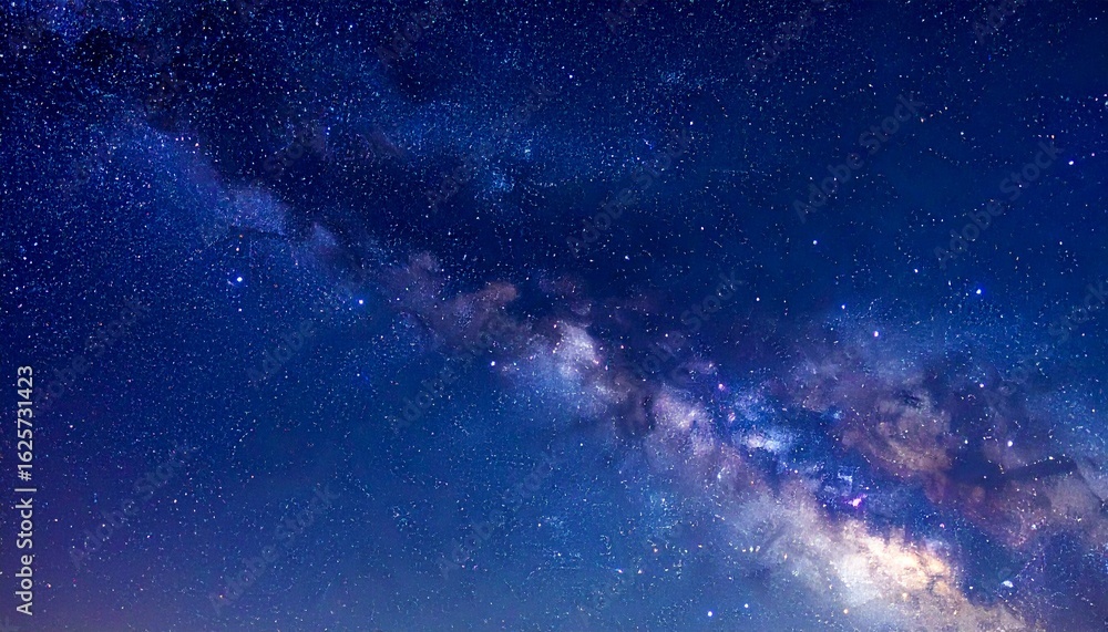 Fototapeta premium Wide night sky reveals bright cluster of distant stars.