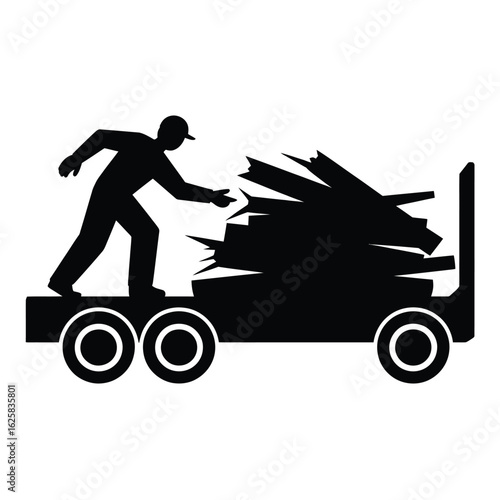 Silhouette of a worker loading logs onto a truck
