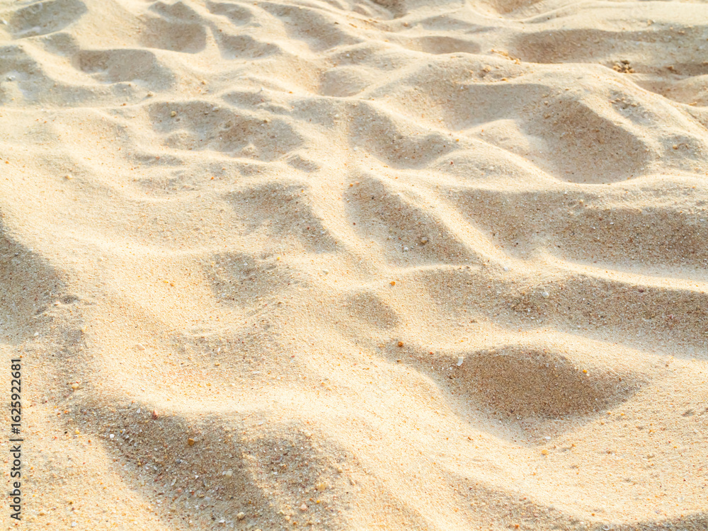 Fototapeta premium Nature travel background, sand beach close up texture summer desert zen garden coast ocean for vacation, hot tropical scene nature, holiday dune pile dry brown heap
