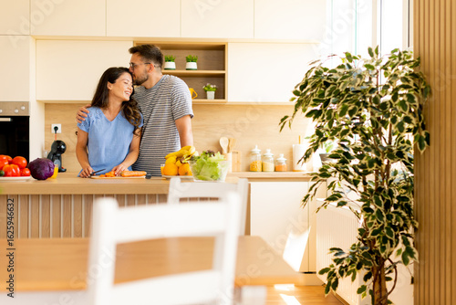 Couple enjoying cooking tog...