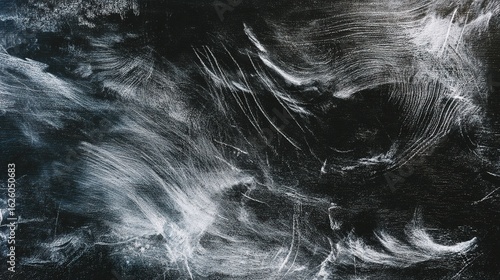 An abstract monochrome texture with organic chalk strokes, creating an artistic pattern.