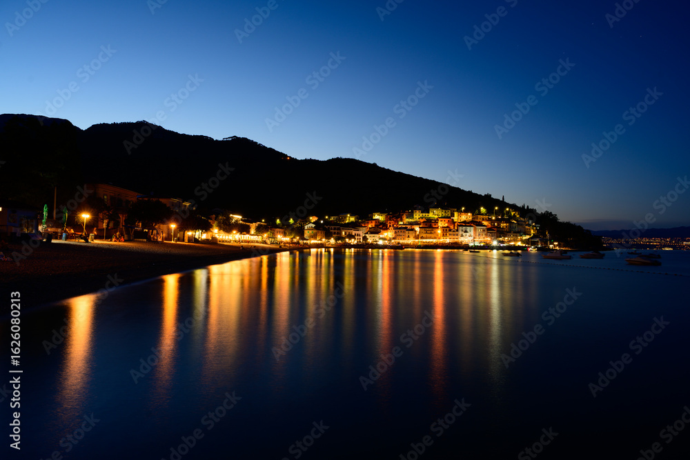 Obraz premium Moscenica Draga Townscape of a Tourist Resort and Beach in Croatia at Night