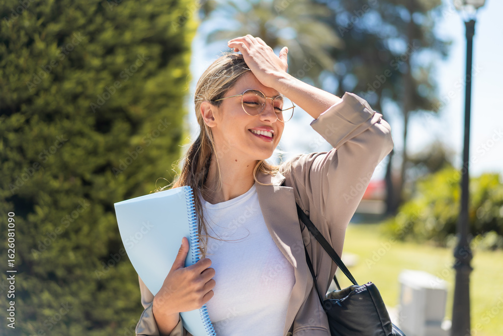 Naklejka premium Pretty student Uruguayan woman at outdoors has realized something and intending the solution