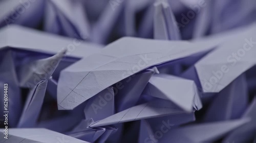 Macro View of Delicate Purple Origami Cranes in Soft Focus, Evoking Serenity and Artistry