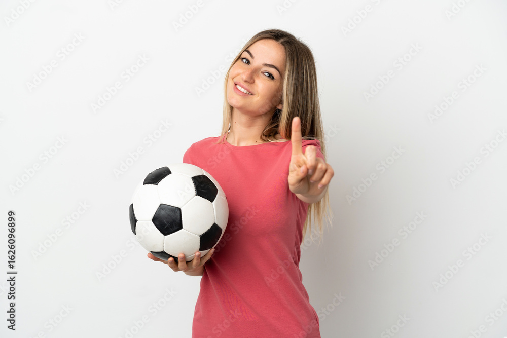 Young football player woman over isolated white wall showing and lifting a finger Young football player woman over isolated white wall showing and lifting a finger