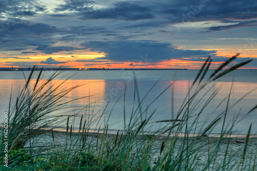 Fototapeta Naklejka Na Ścianę i Meble -  Sunset over the Baltic Sea beach in Gorki Zachodnie, Gdansk. Poland