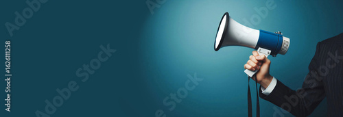Hand with a megaphone on a blue background.