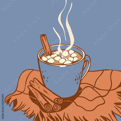 Steaming hot drink in blue mug with cinnamon stick on brown blanket during autumn season
