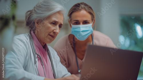 An elegantly crafted scene showing collegial healthcare team: doctor, nurse, and medical assistant in action - caring for a patient with laptop and stethoscope in a contemporary hospital environment.
