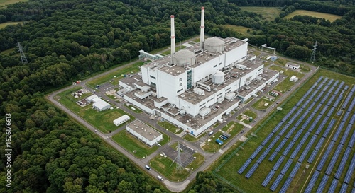 Aerial View of Nuclear Power Plant with Solar Panels