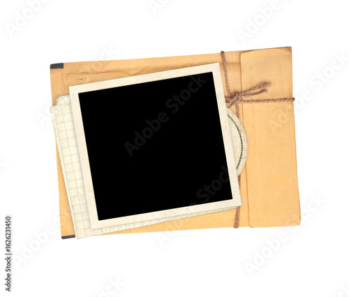 Top view of blank vintage aged letter paper envelope and blank photo frame. Retro photo on with envelope with a rope is depicted.  Nostalgic scrapbooking style. Isolated on white background